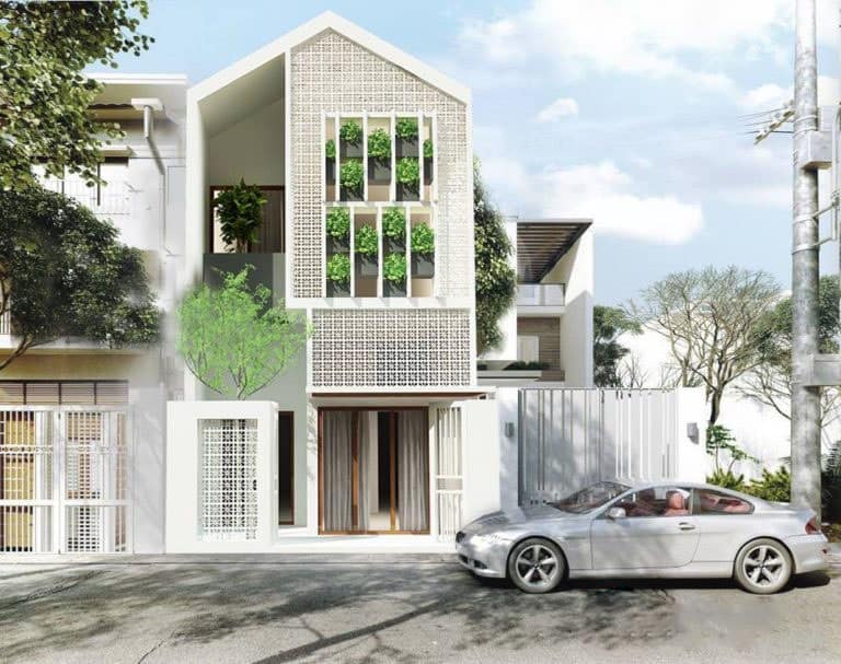 Mặt tiền nhà phố đẹp 3 – Ngôi nhà là khối kiến trúc trắng tinh thuần khiết nhẹ nhàng cùng họa tiết hoa gió trang nhã.